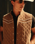 Luxury Western Golf apparel Man wearing a quilted vest, white cowboy hat, and sunglasses against a dark background